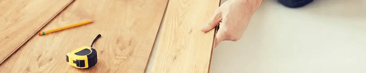 A professional installing wood flooring in Columbus, GA