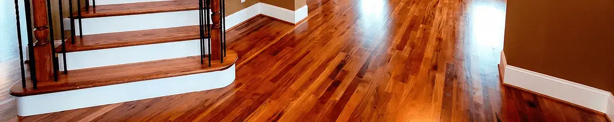 Base floor of a staircase with professionally restored wood flooring in Columbus GA