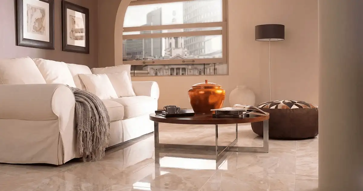 Modern living room with professionally installed marble flooring, a beige sofa, coffee table in Columbus, GA