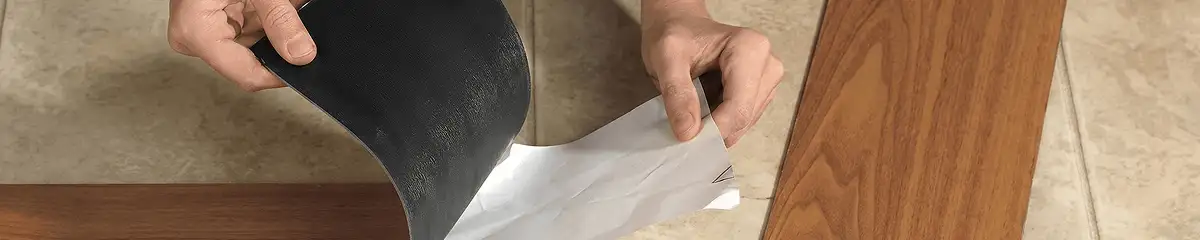 A professional installing vinyl flooring in Columbus, GA