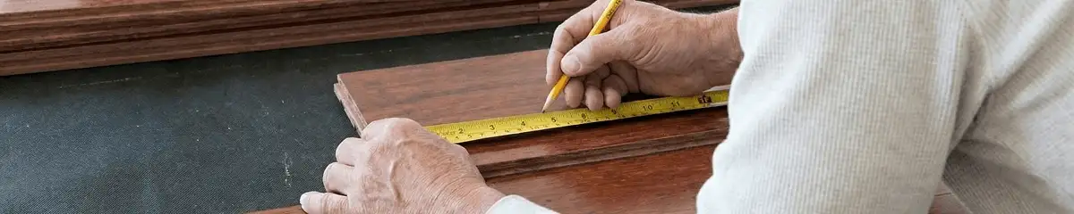 A professional installing wood flooring in Columbus, GA